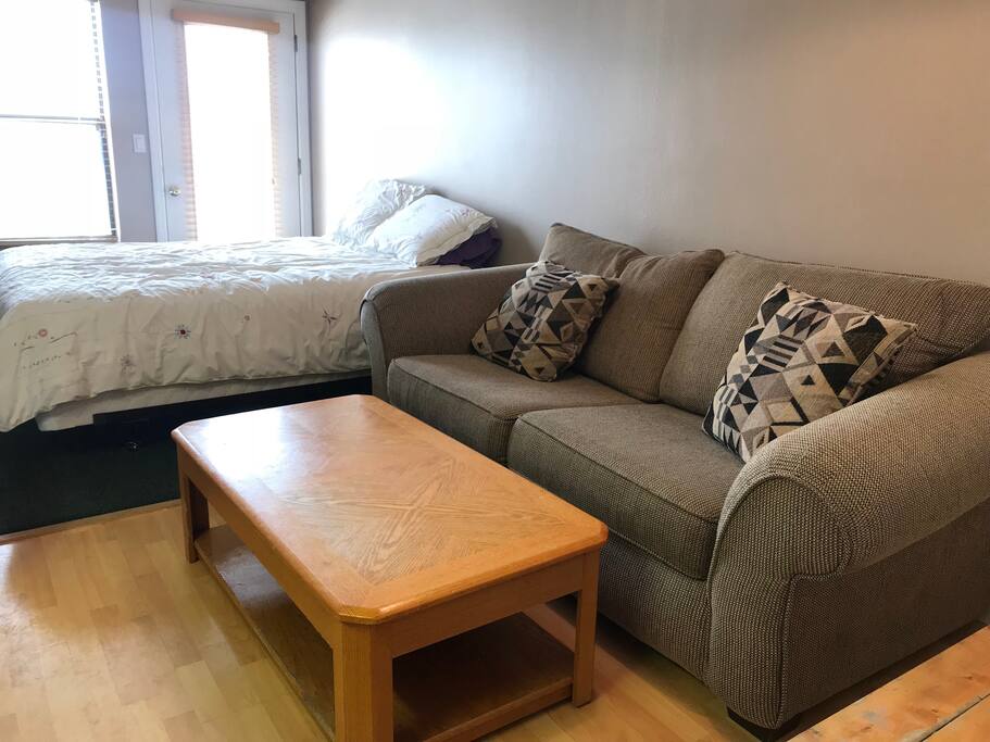 Sofa sleeper and the table rises up to be a dining table.