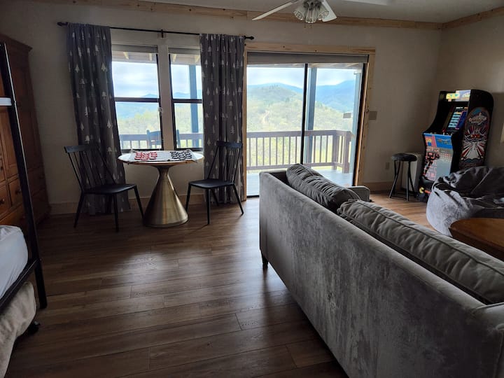 Lower level bunk room + game room. 