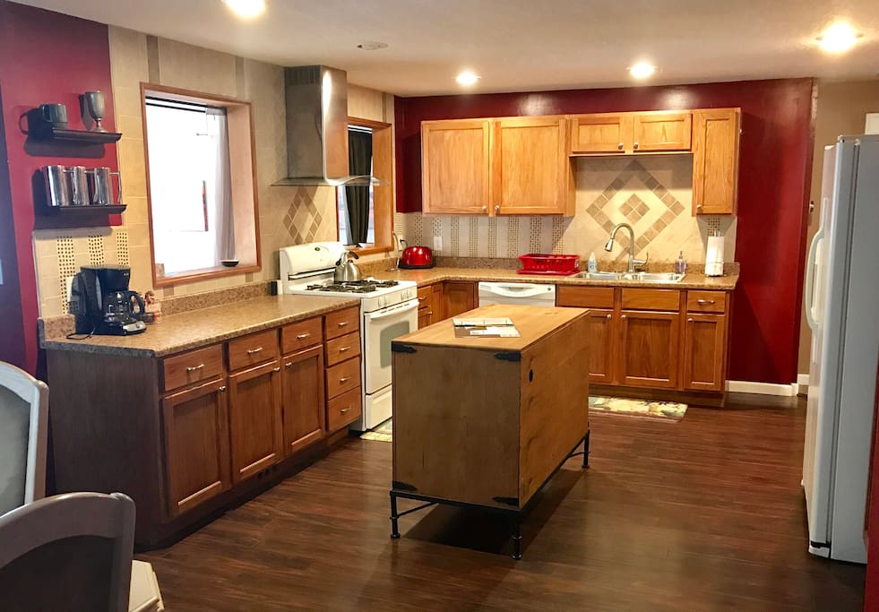 Large kitchen with flatware, utensils, gadgets and even some coffee to get you started