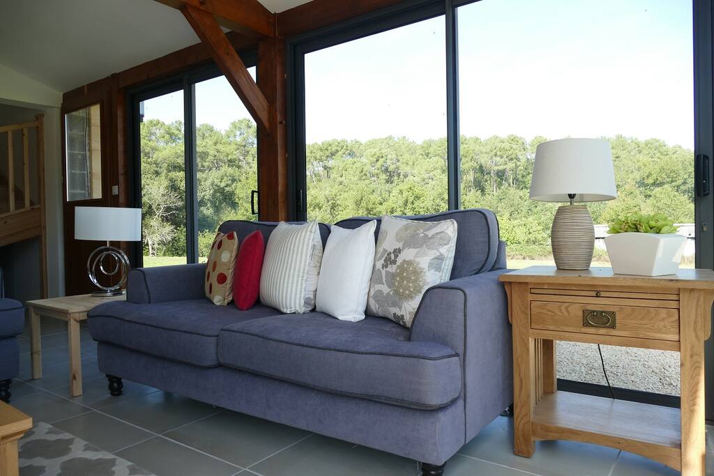 Large open plan sitting area with large glass windows