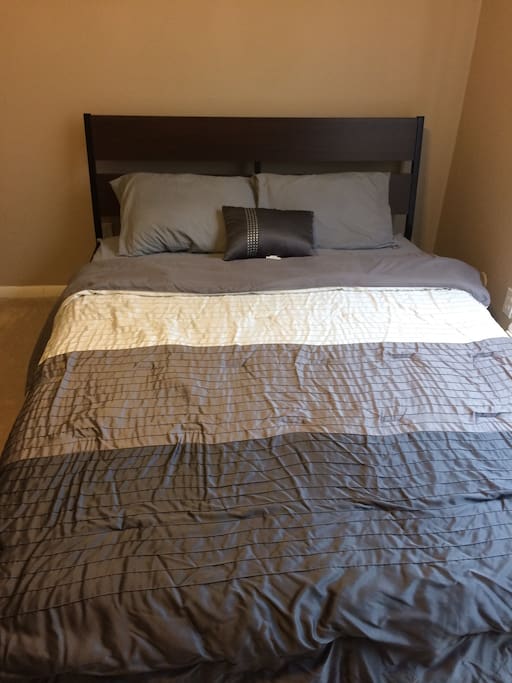 The guest bedroom features a queen-sized bed. Enjoy a good night's rest!