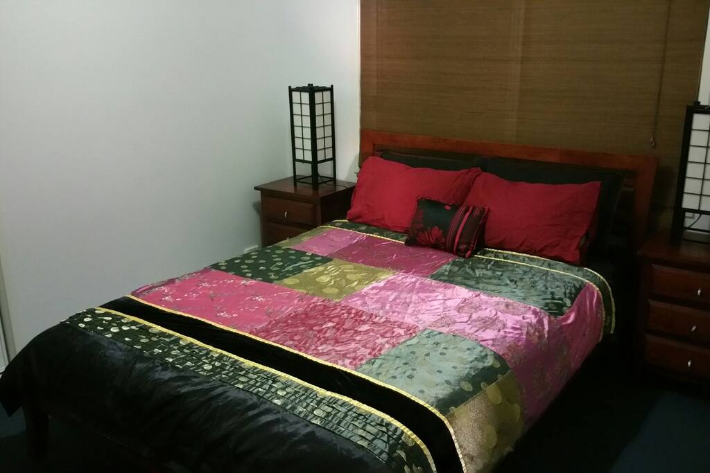 Guest bedroom with queen size bed.