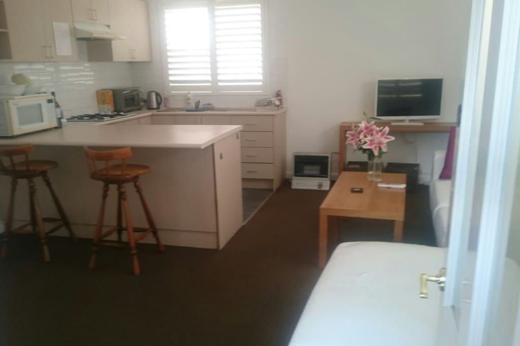 kitchen and lounge. kitchen fully functional. has everything from rice cooker to sandwich toaster, bench top oven and microwave.