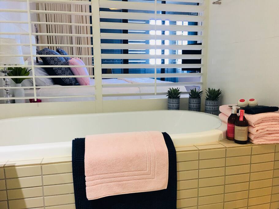 Enjoy a soak in the large tub! Bathroom also includes separate shower and toilet.