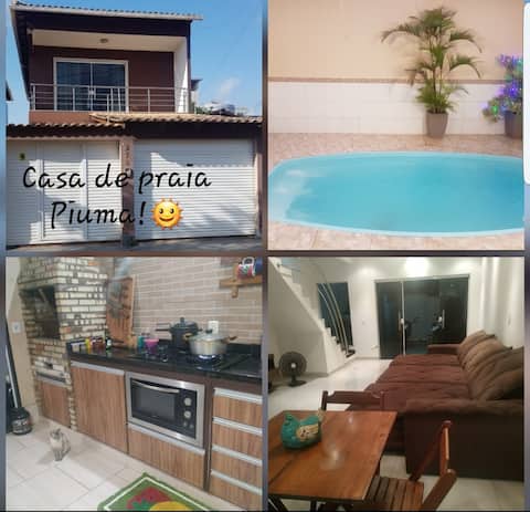 home with a swimming pool, barbecue area, and Piuma ES air