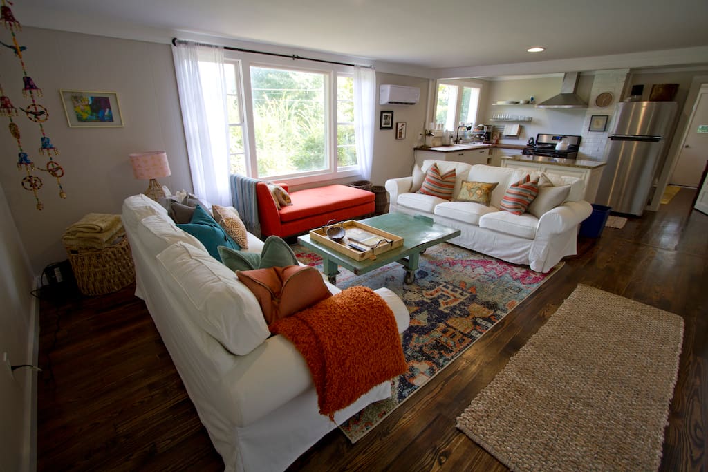 Bright and happy living room with plenty of seating.