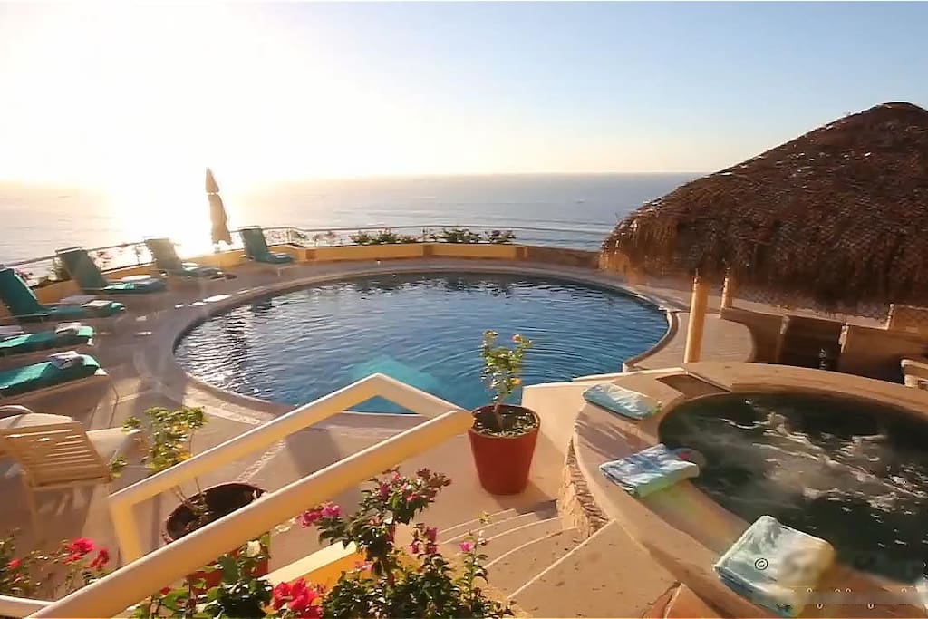 Large pool and deck with ample chaises to soak up the sun
