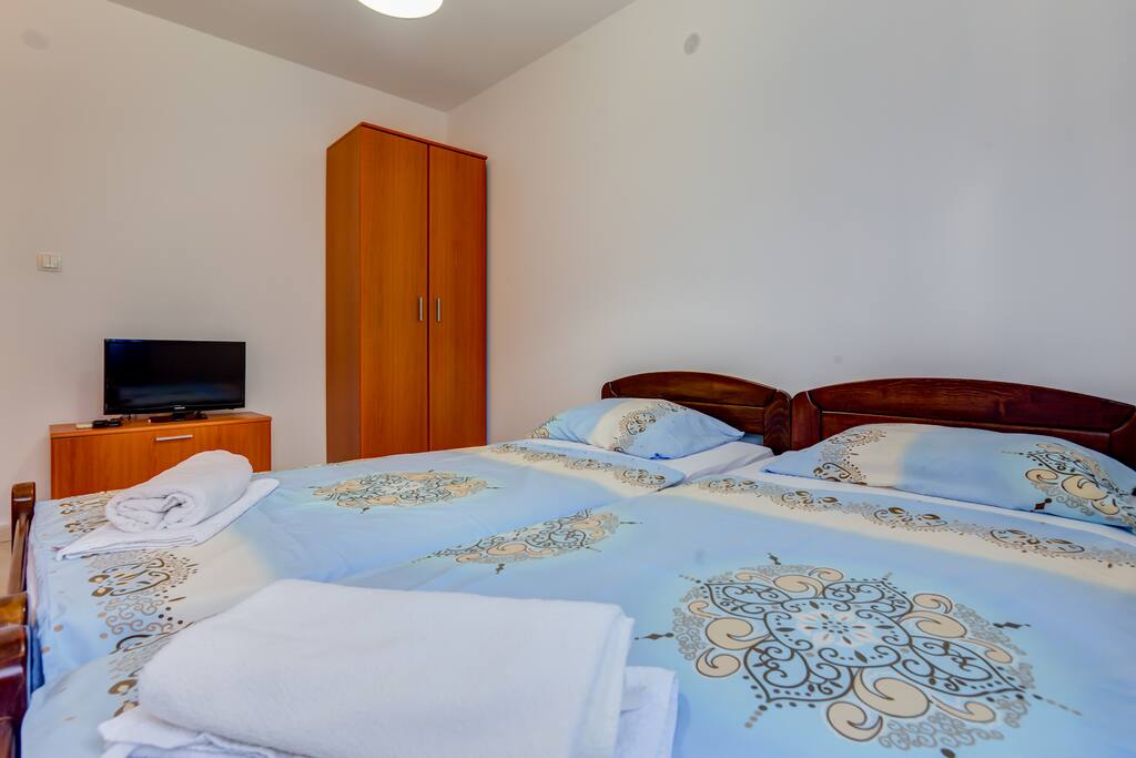 Two single beds are put together if you prefer to snuggle with that one special person. If not, you can separate them.
