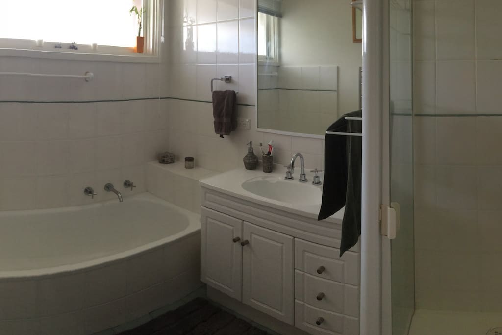 Main bathroom with shower, vanity and bath. Heated towel rail also. Separate toilet.