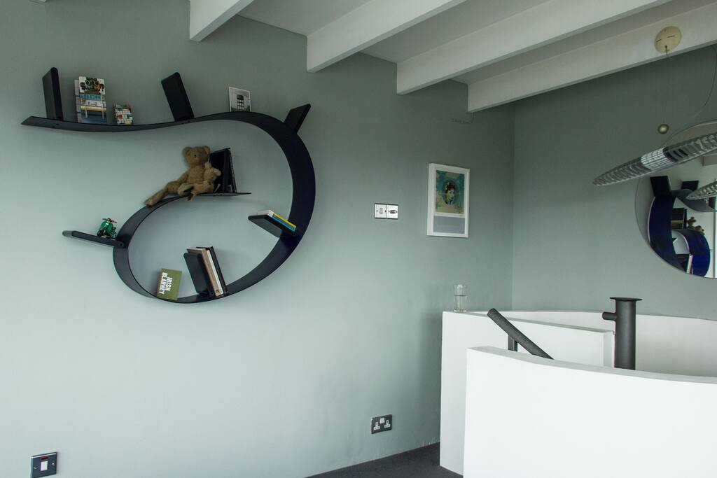 Bedroom detail, Ron Arad Bookworm shelving
