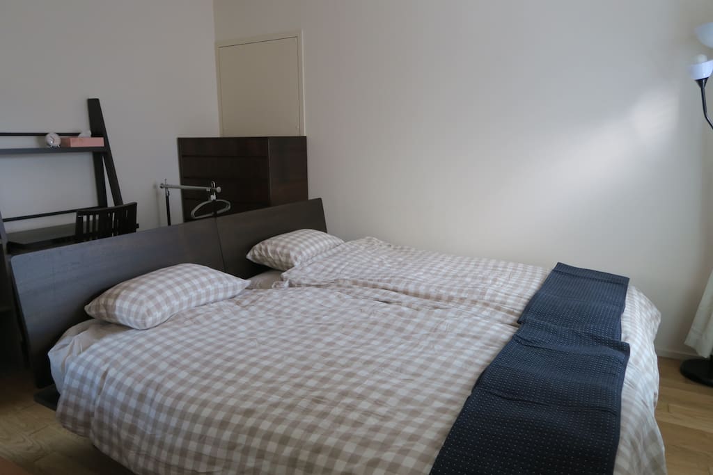 Two single beds are put side by side.