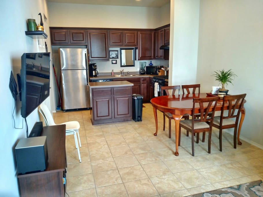 Open floor plan of kitchen/dining/living area