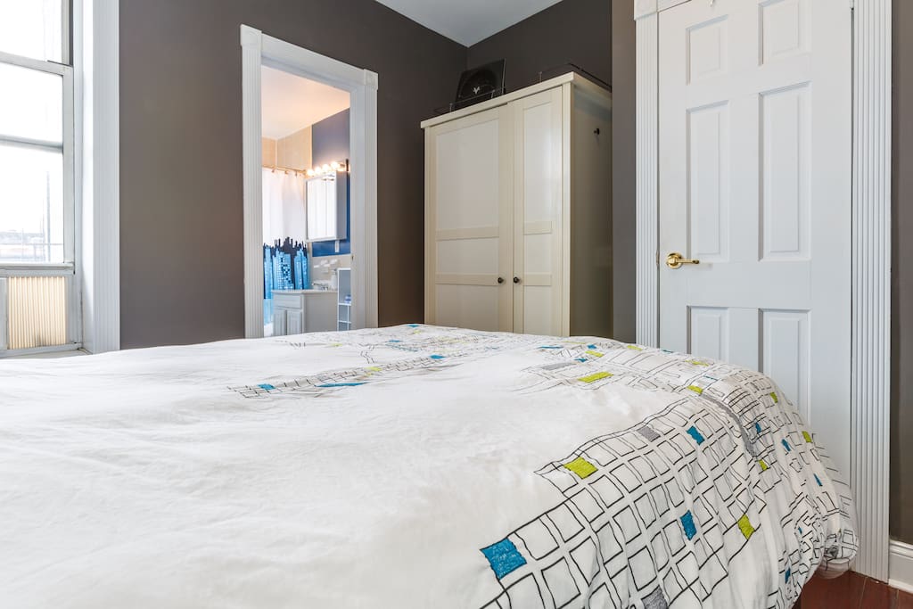 Wardrobe, closet, and chest of drawers for personal storage.