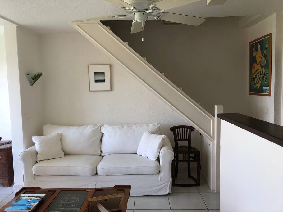 Living room with stairs to master bedroom