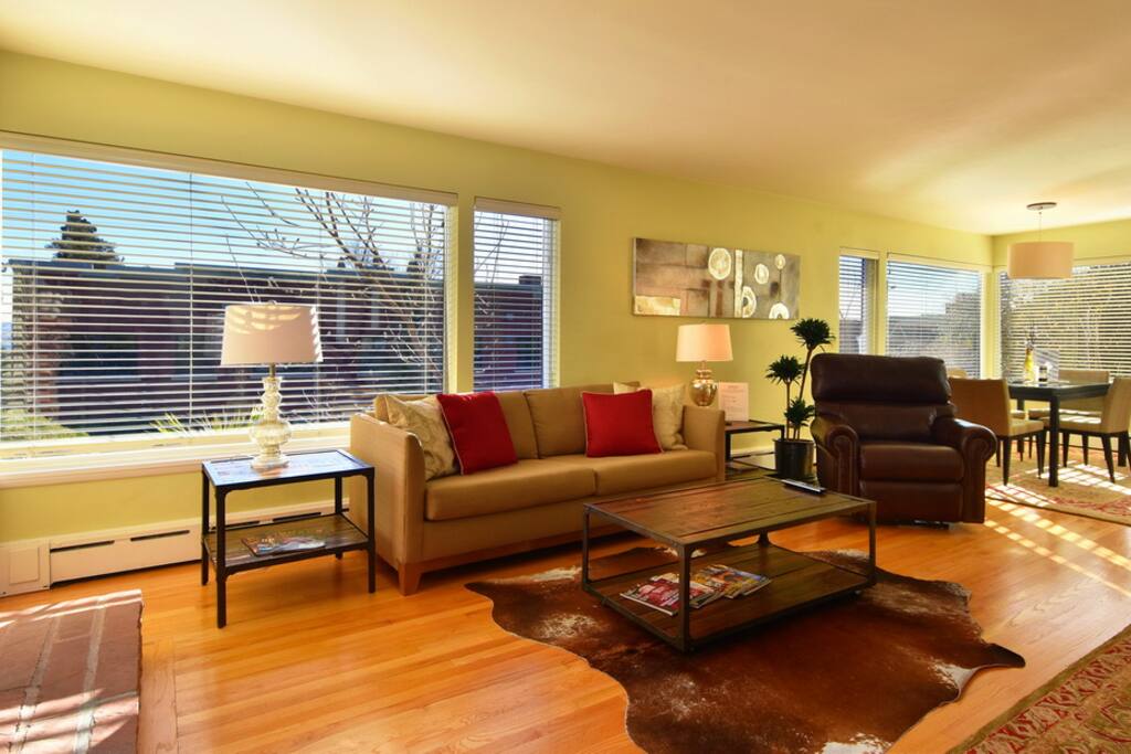 Large And Bright Open Living Room Leads To Kitchen & Dining Area.