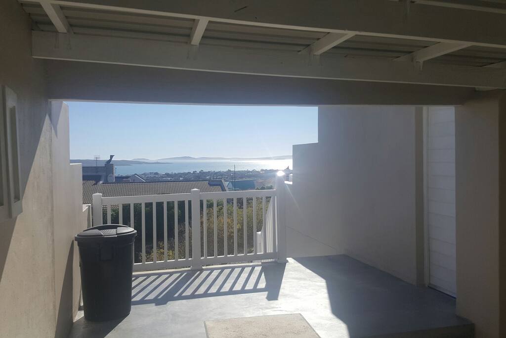 Balcony outside with braai area and 8 seat table