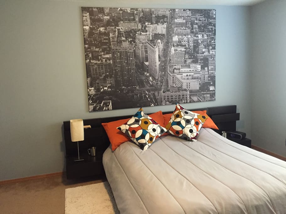 This suite offers a comfortable queen size bed with plenty of natural light.