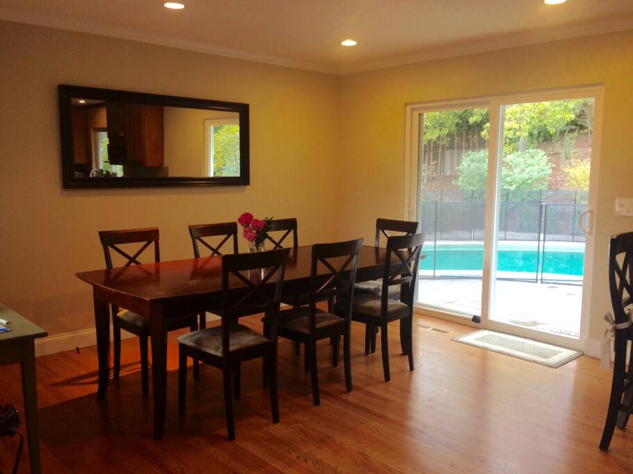Dining room, next to open kitchen and opening up to patio and pool