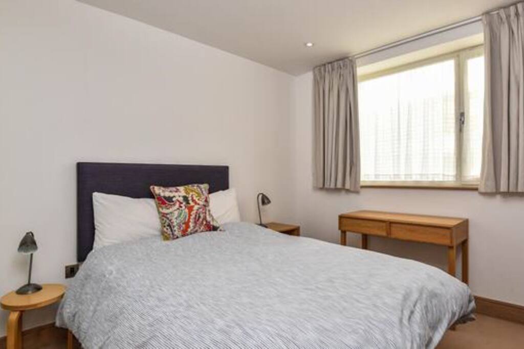Double bed with feather duvet and pillows