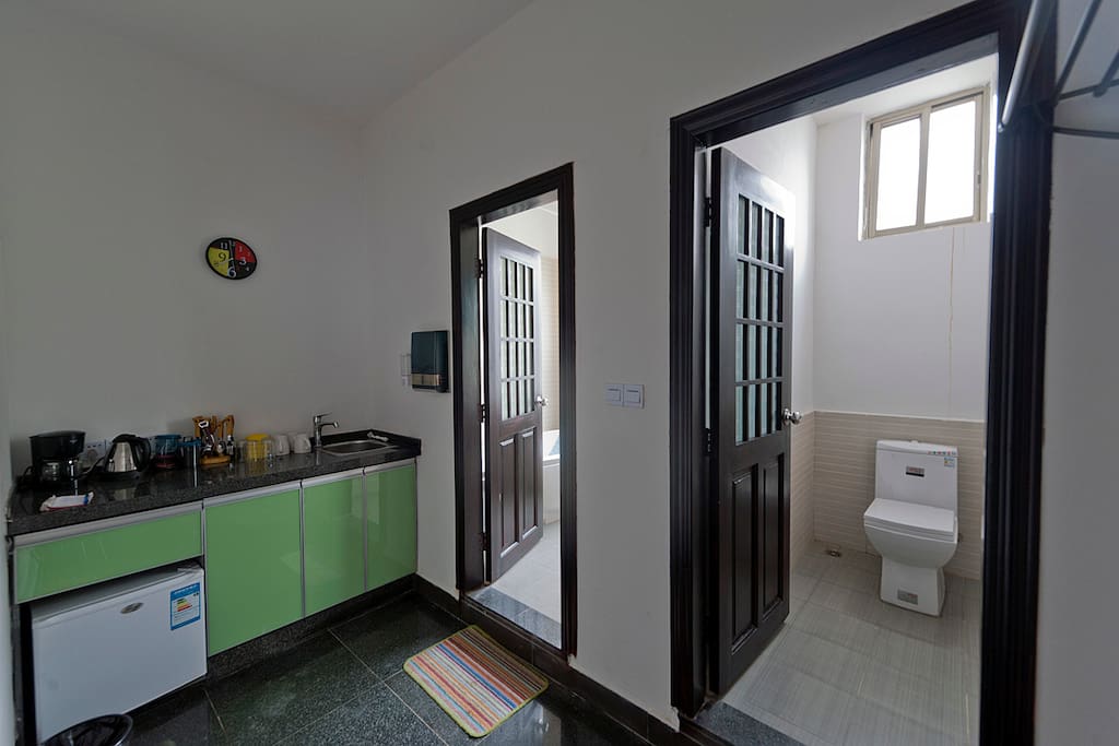 Kitchenette and bathroom with western toilets.
