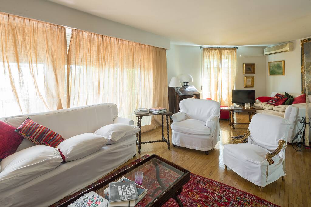 Living area. There is plenty of seating with 3 sofas and 4 armchairs.