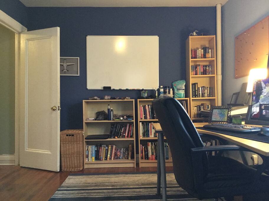 The office part of the bedroom (I work rom home). Hamper for dirty clothes, whiteboard for writing notes or important dates, cork board for organizing important paperwork, and full library - plenty of novels, which you’re welcome to help yourself to.