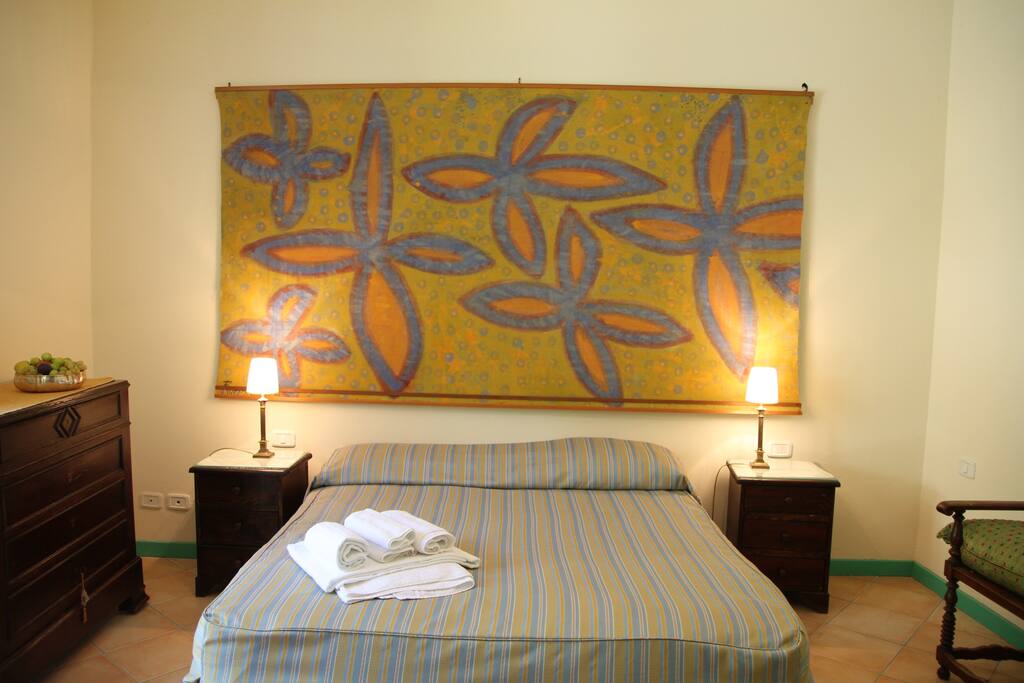 The private bedroom: the comfortable double bed with soft bed-linen and towels