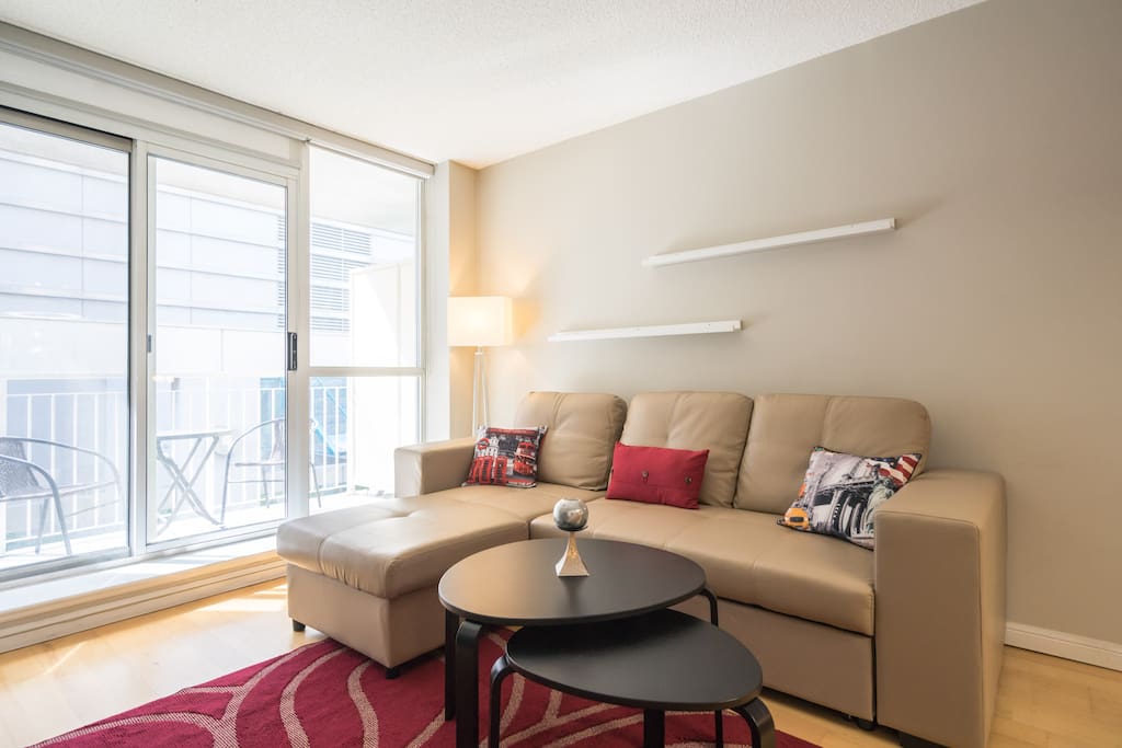 Luxury one bedroom condo has a brand new sofa with pull out bed and chaise for relaxation and comfort.