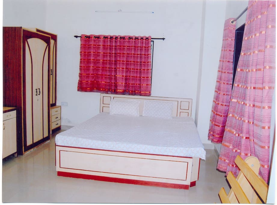 Bedroom with attached bathroom and a King size bed