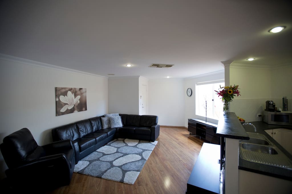 Open plan lounge, dining & kitchen area.