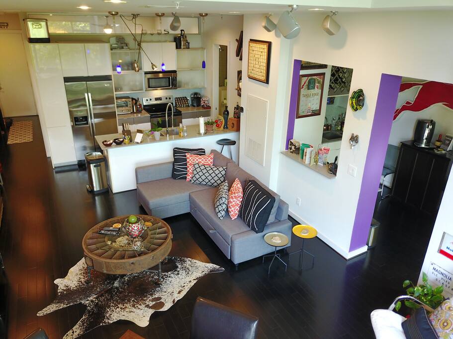 Living area, kitchen, wet bar / study to the right with porch to the outside.