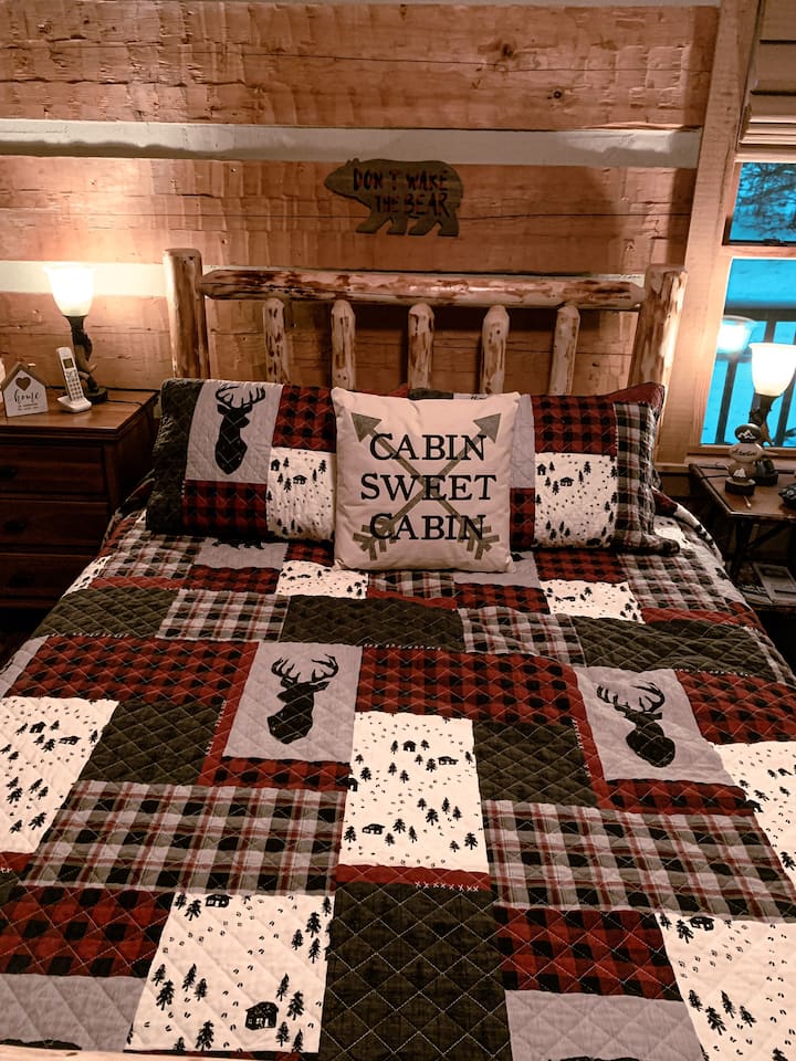 Master Bedroom (Bear Den) with custom log bed and luxury DreamCloud mattress and luxury linens.