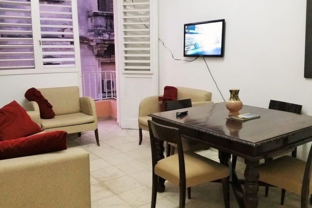 On this pick you can see a glance of the mixed famous Cuban architectonics from the balcony. The dinner area is a part of the living room.