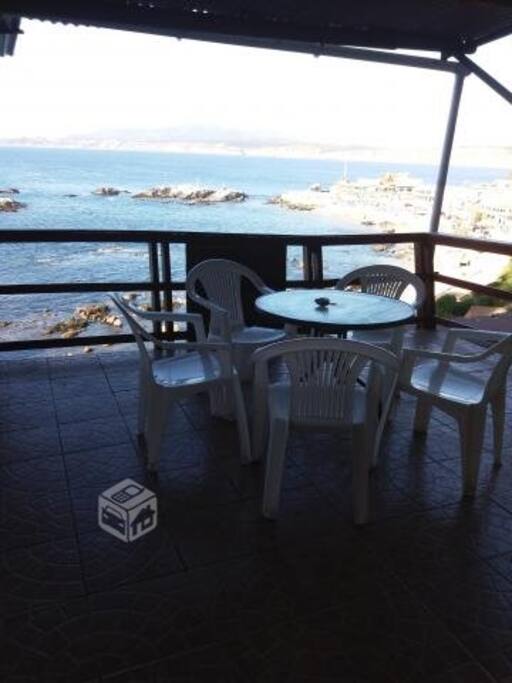 Outside eating area with ocean view.