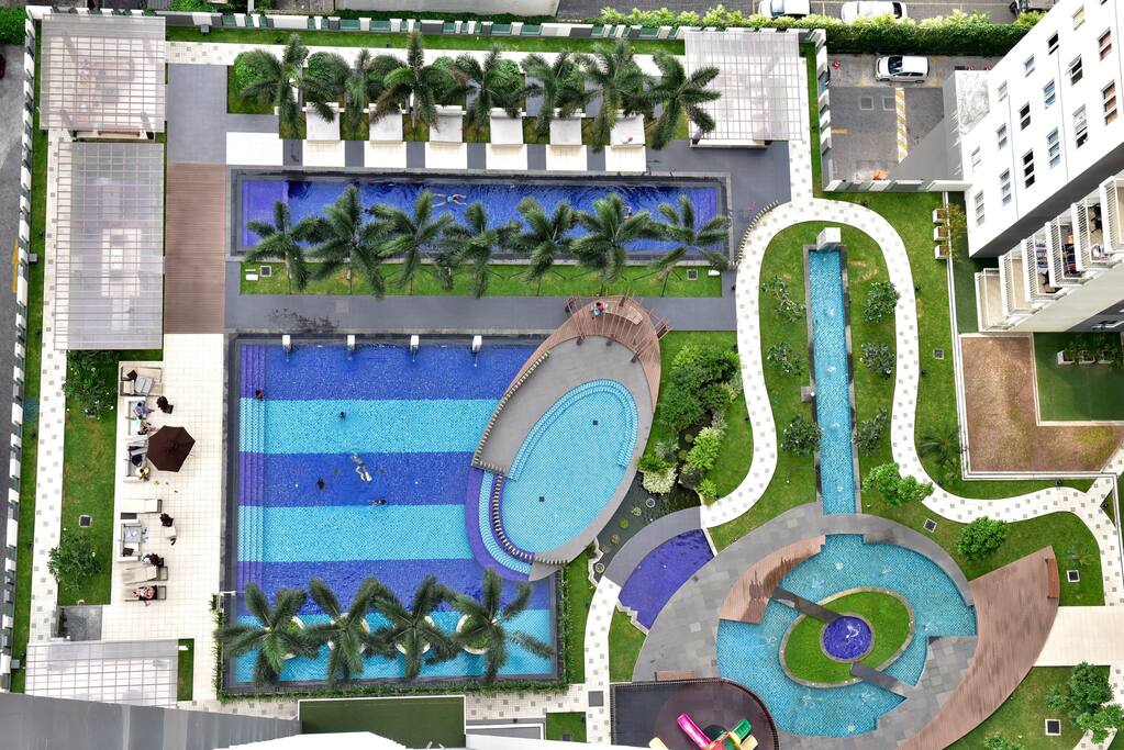 Main, Lap and Kids Pool with BBQ resting, seating garden.
