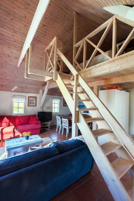 Living area and stairs to loft.