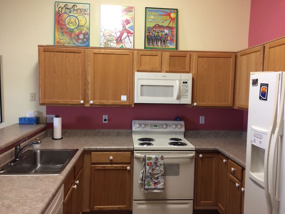 Kitchen area stocked with kitchen basics (pots, pans, utensils, Keurig, etc.)