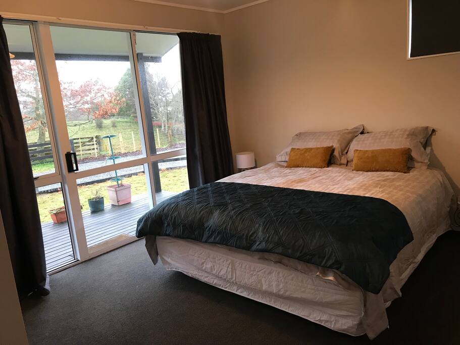 King size bed, built in robe, sliding door out onto the deck.
