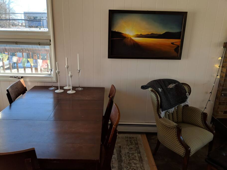 Dining area seats 5, artwork by local artists