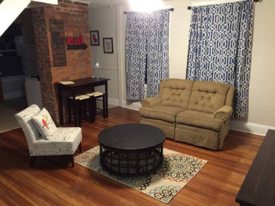 Spacious living room with eclectic-chic charm.