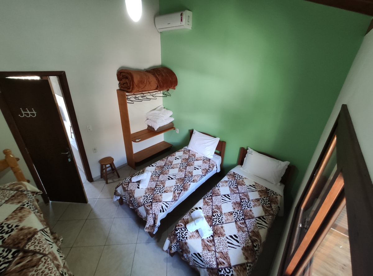 Back bedroom.
Single beds can form a double.