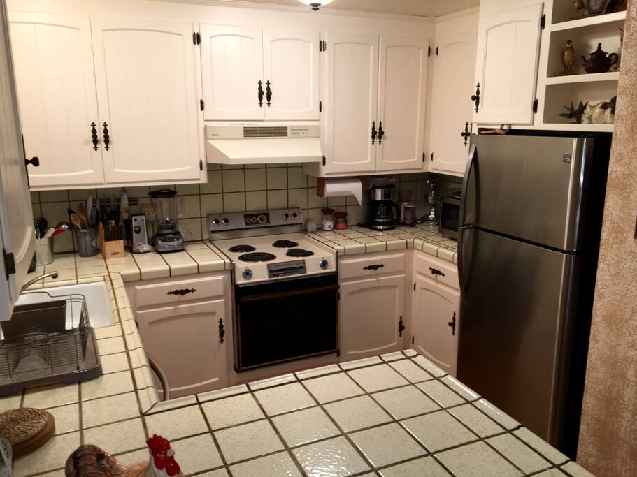 Kitchen has a spacious refrigerator, dishwasher, oven/stove top and lots of counter space.