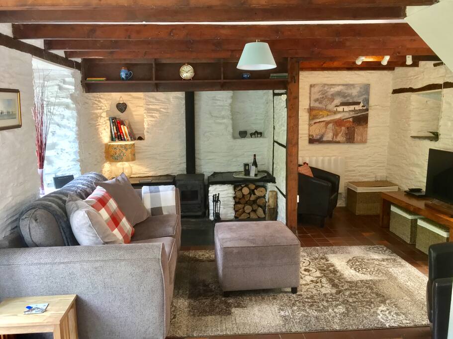 Comfortable lounge to relax in with wood burner.