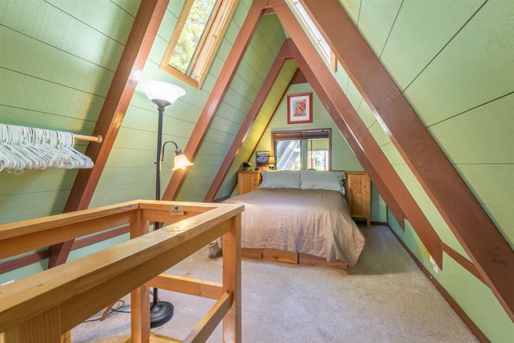 Loft Bedroom with queen bed and steep stairs to access it