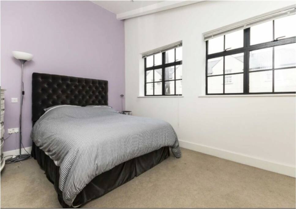 Spacious and light master bedroom with king sized bed