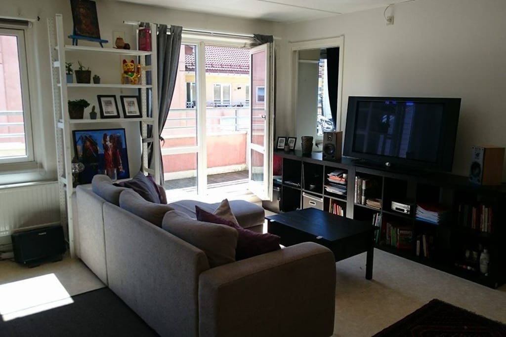 Our living room with door to balcony, TV, stereo and an expandable sofabed. The picture is dark, but that's because the room is so bright because of the sun.
Picture from seperate bedroom will be uploaded.