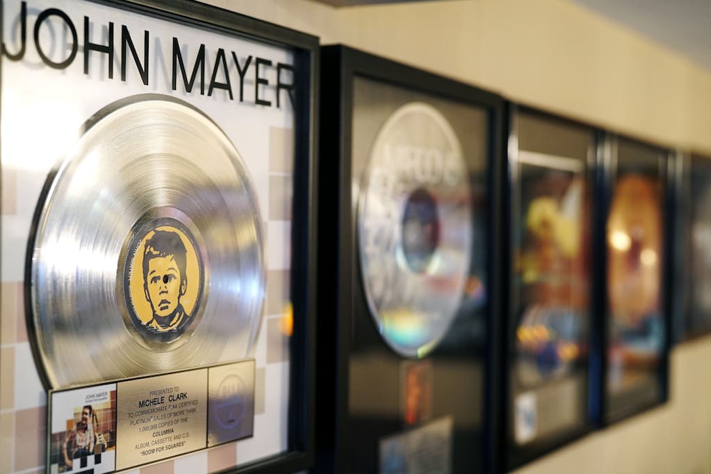 Walls are decorated with awards and platinum records presented to the owner for the artists she helped get played on the radio !