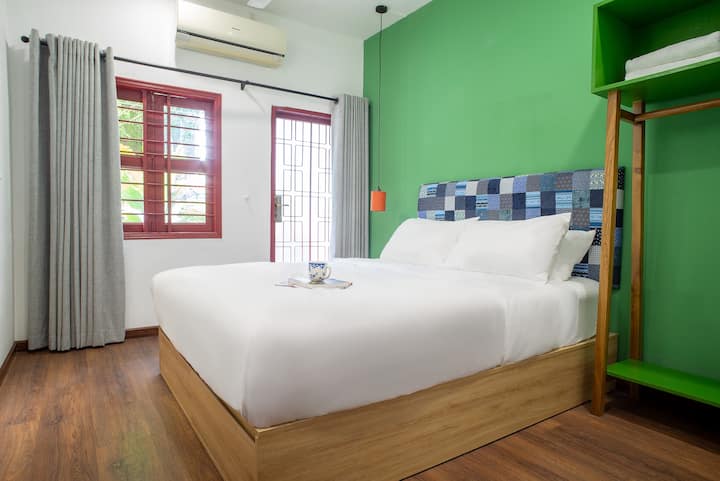 Our second bedroom features a private balcony and hotel-quality bed