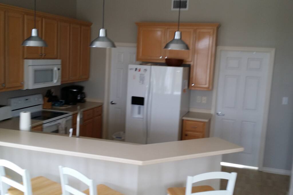 Kitchen is fully furnished with dishes, utensils, pots/pans