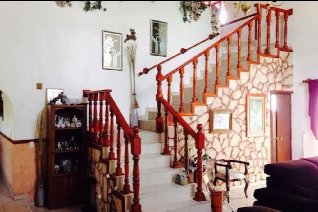 Living room and the stairs that leads to your room, right after entering the house